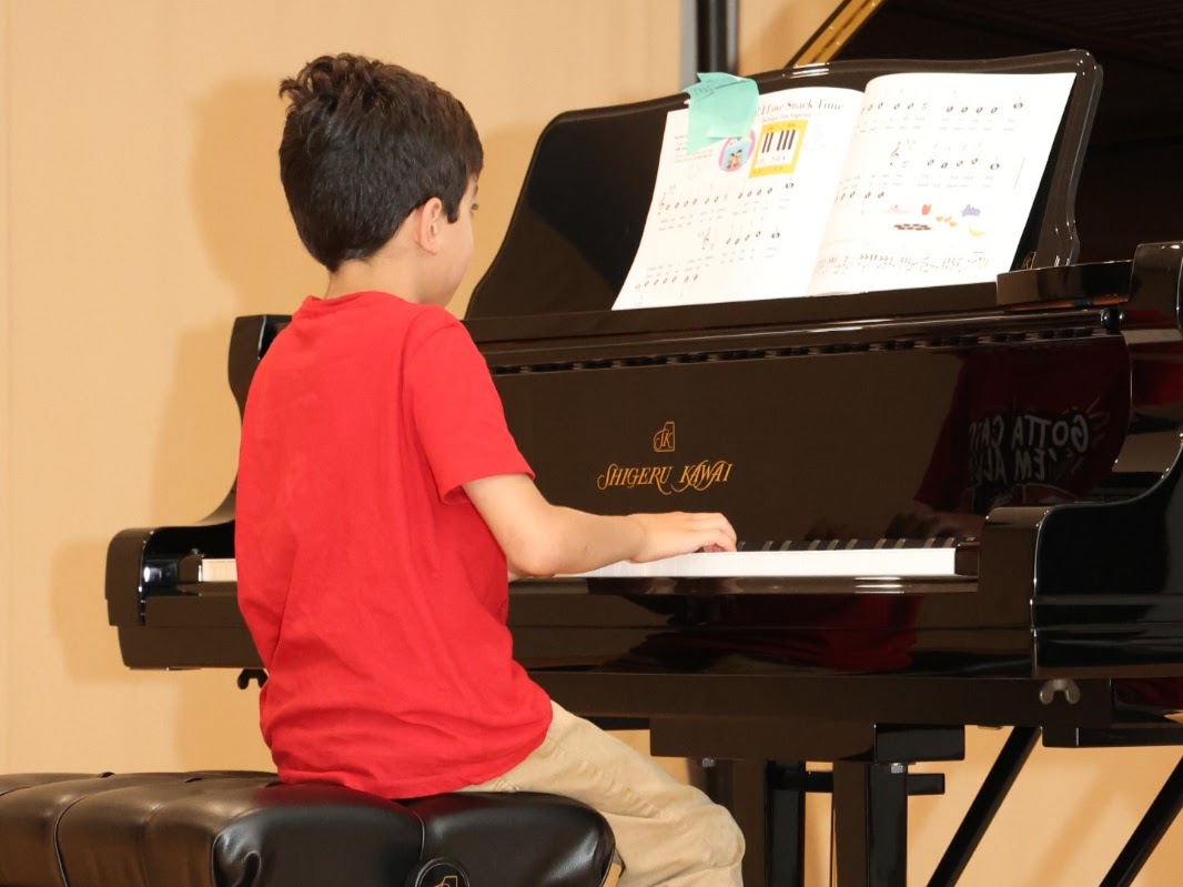 Close-up of hands on instrument